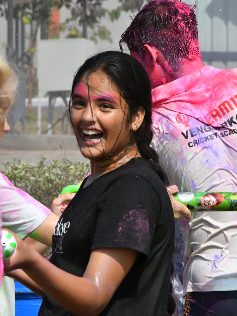 A pupil laughing during a house celebration